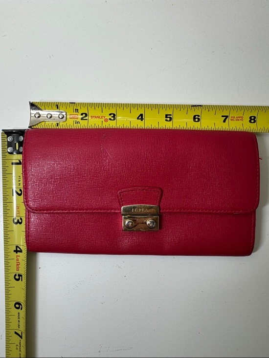 Handbags - Furla red textured wallet.